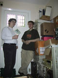 [Photo of Joseph Myers and Simon Frankau with various computer equipment]