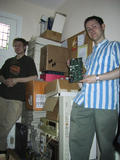 [Photo of Simon Frankau and Neil Johnson with various computer equipment]